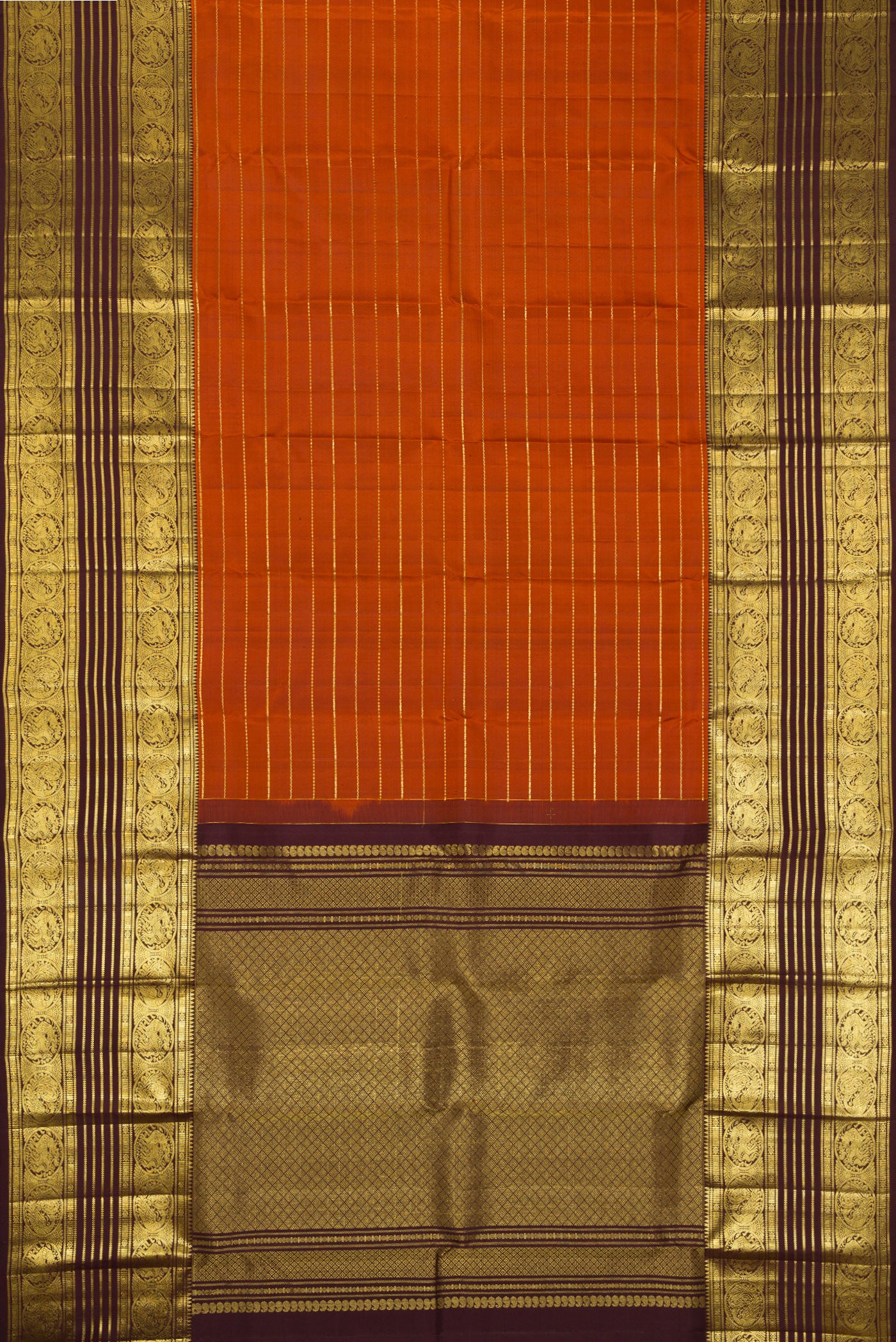 Flat view of Brick Orange Dual Tone Kanchipuram Silk Saree with Stripes on the body and Zari Border. 