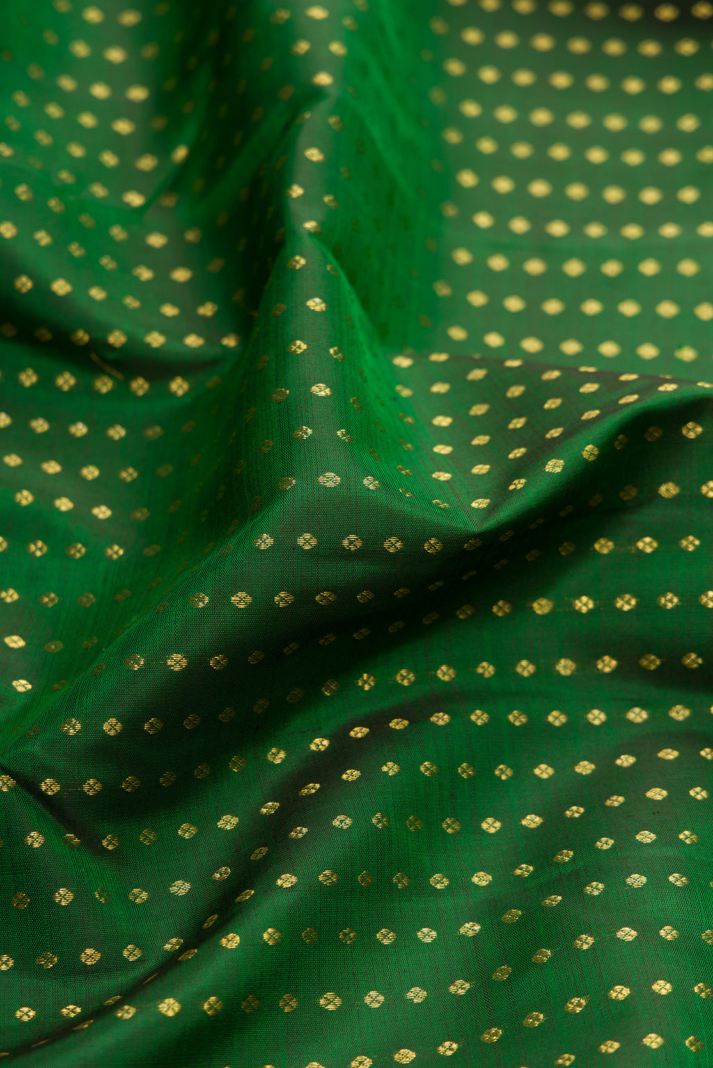 Close up of Bottle Green Dual Tone Kanchipuram Silk Saree with Stripes on the body and Zari Border.  displaying folds