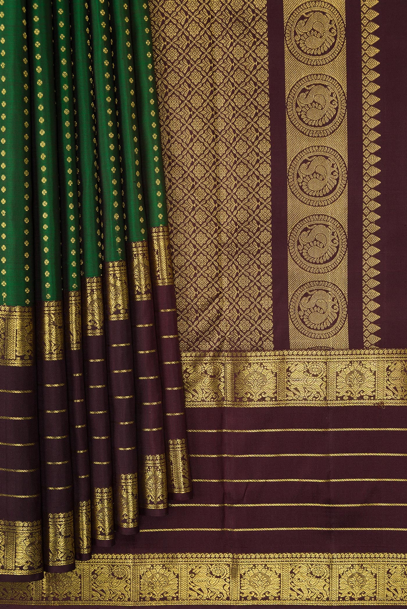 Pleats and pallu of Bottle Green Dual Tone Kanchipuram Silk Saree with Stripes on the body and Zari Border. 