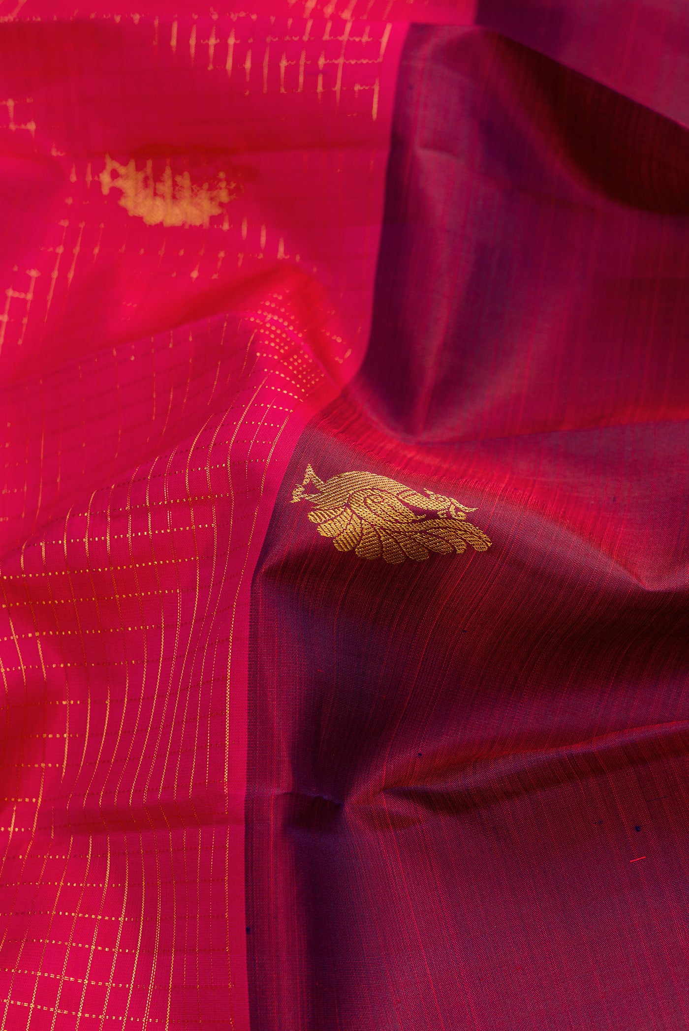 Close up of Burgundy and Pink Color Kanchipuram Silk Saree with Half And Half on the body and Without Border.  displaying folds