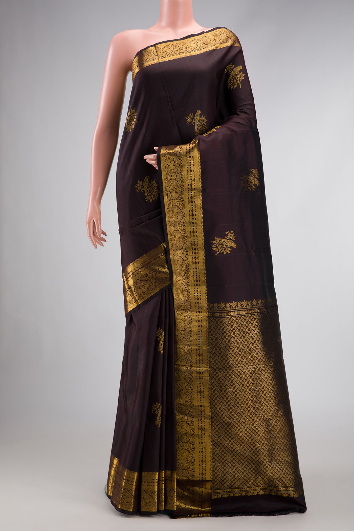 Coffee Brown Dual Tone Kanjivaram Silk Saree with Zari Butta on the body and Zari Border.  displayed on a mannequin