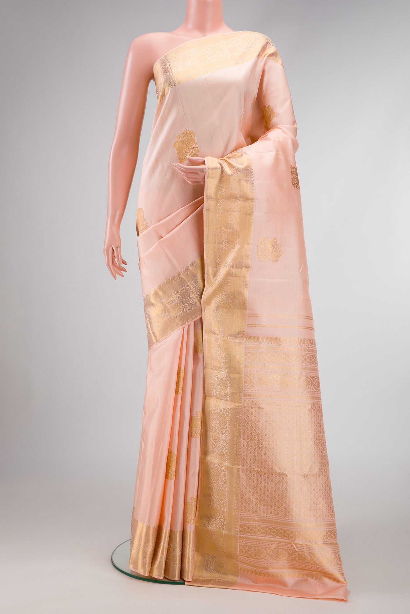 Pink Dual Tone Kanjivaram Silk Saree with Zari Butta on the body and Zari Border.  displayed on a mannequin