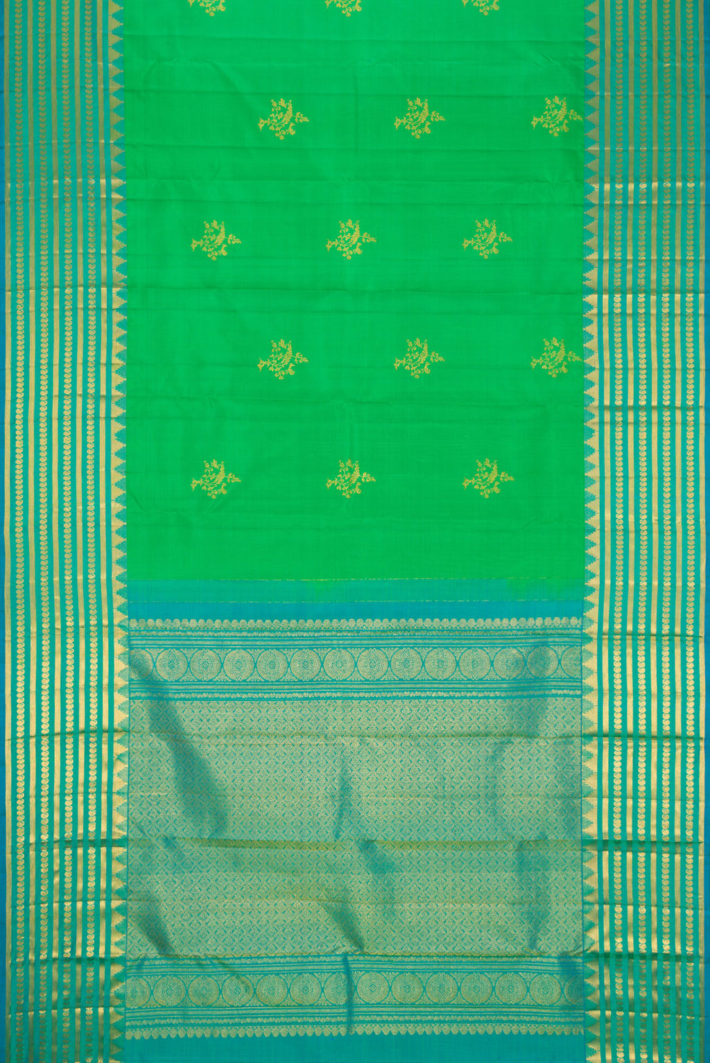 Flat view of Green Dual Tone Kanchipuram Silk Saree with Zari Butta on the body and Zari Border. 