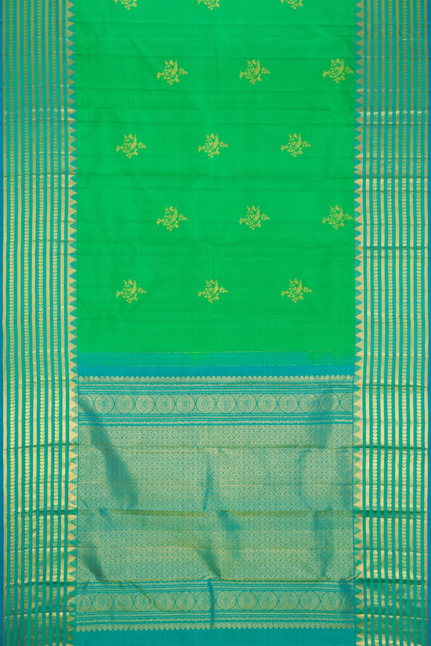 Flat view of Green Dual Tone Kanchipuram Silk Saree with Zari Butta on the body and Zari Border. 