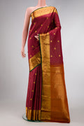 Maroon Dual Tone Kanjivaram Silk Saree with Checked design on the body and Zari Border.  displayed on a mannequin