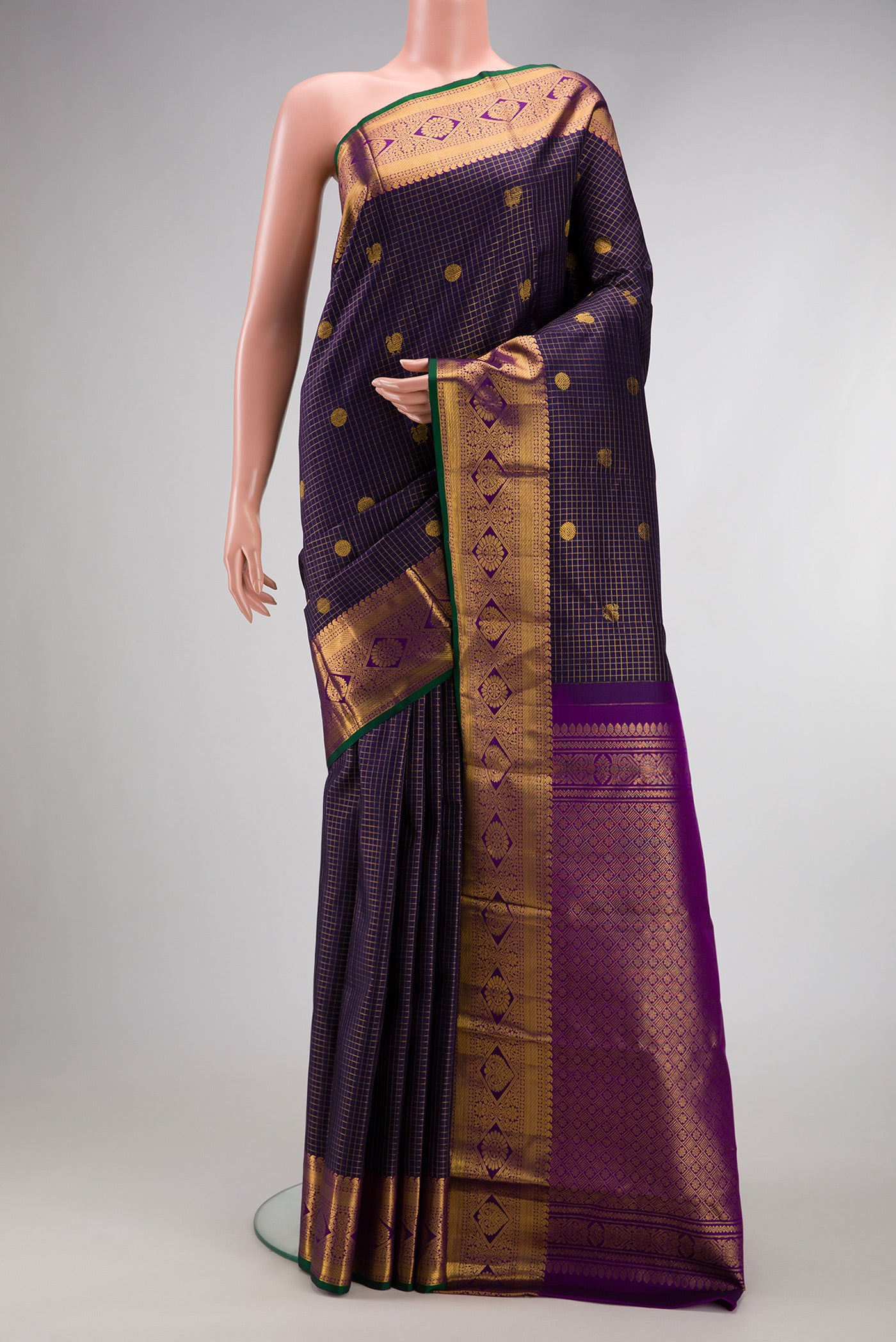 Navy Blue Dual Tone Kanjivaram Silk Saree with Checked design on the body and Zari Border.  displayed on a mannequin