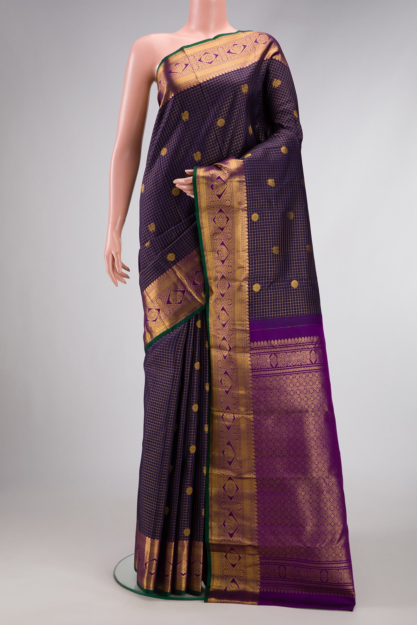 Navy Blue Dual Tone Kanjivaram Silk Saree with Checked design on the body and Zari Border.  displayed on a mannequin