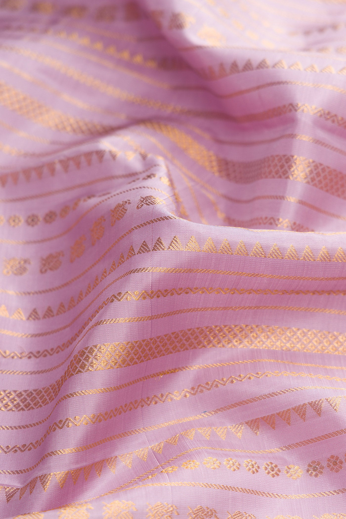 Close up of Lavender Dual Tone Kanchipuram Silk Saree with Stripes on the body and Without Border.  displaying folds