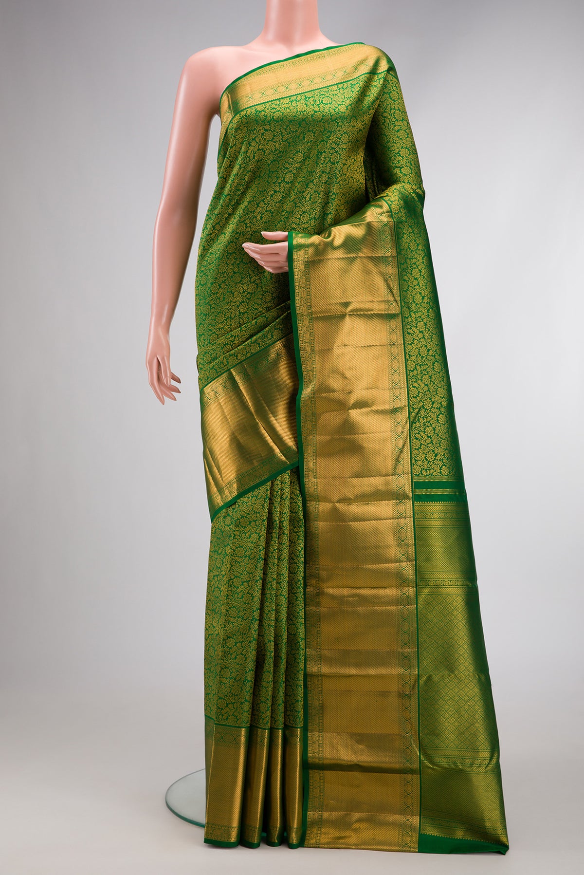 Bottle Green Dual Tone Kanchipuram Silk Saree with Zari Brocade on the body and Zari Border.  displayed on a mannequin