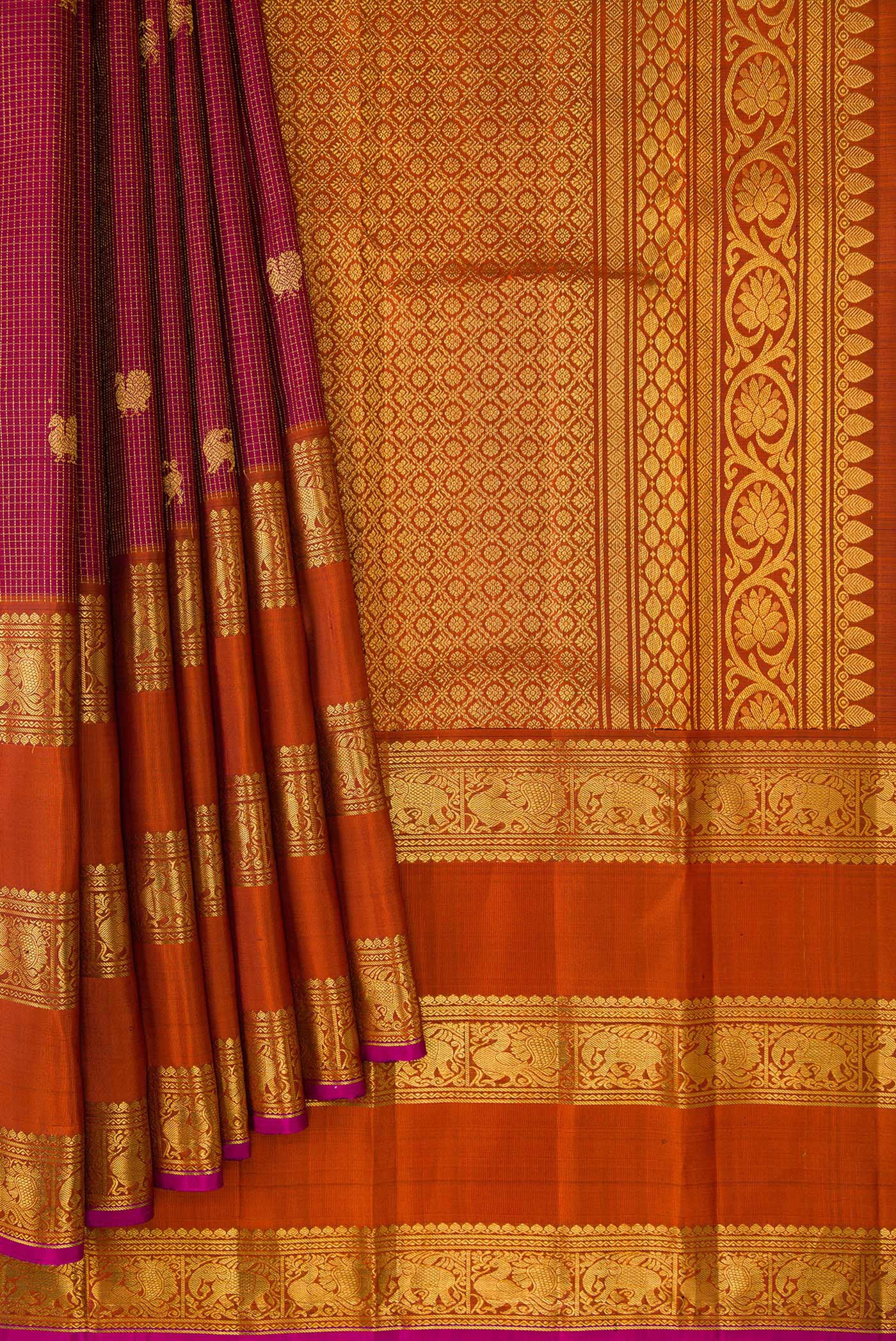 Pleats and pallu of Maroon Kanjivaram Silk Saree with Zari Butta on the body and Zari Border. 