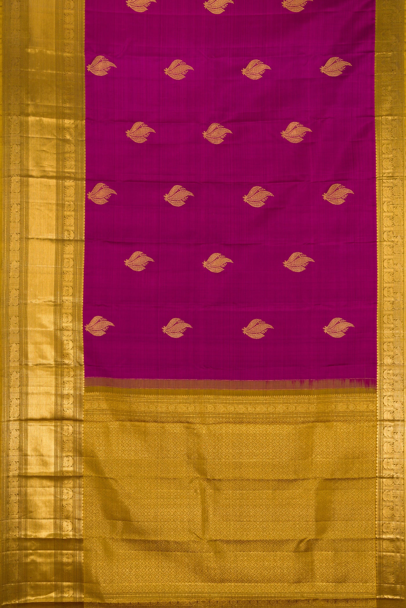 Flat view of Magenta Kanchipuram Silk Saree with Zari Butta on the body and Zari Border. 