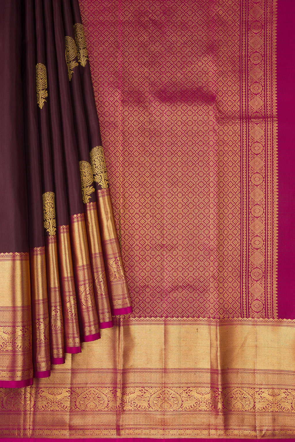 Pleats and pallu of Brown Kanchipuram Silk Saree with Zari Butta on the body and Zari Border. 