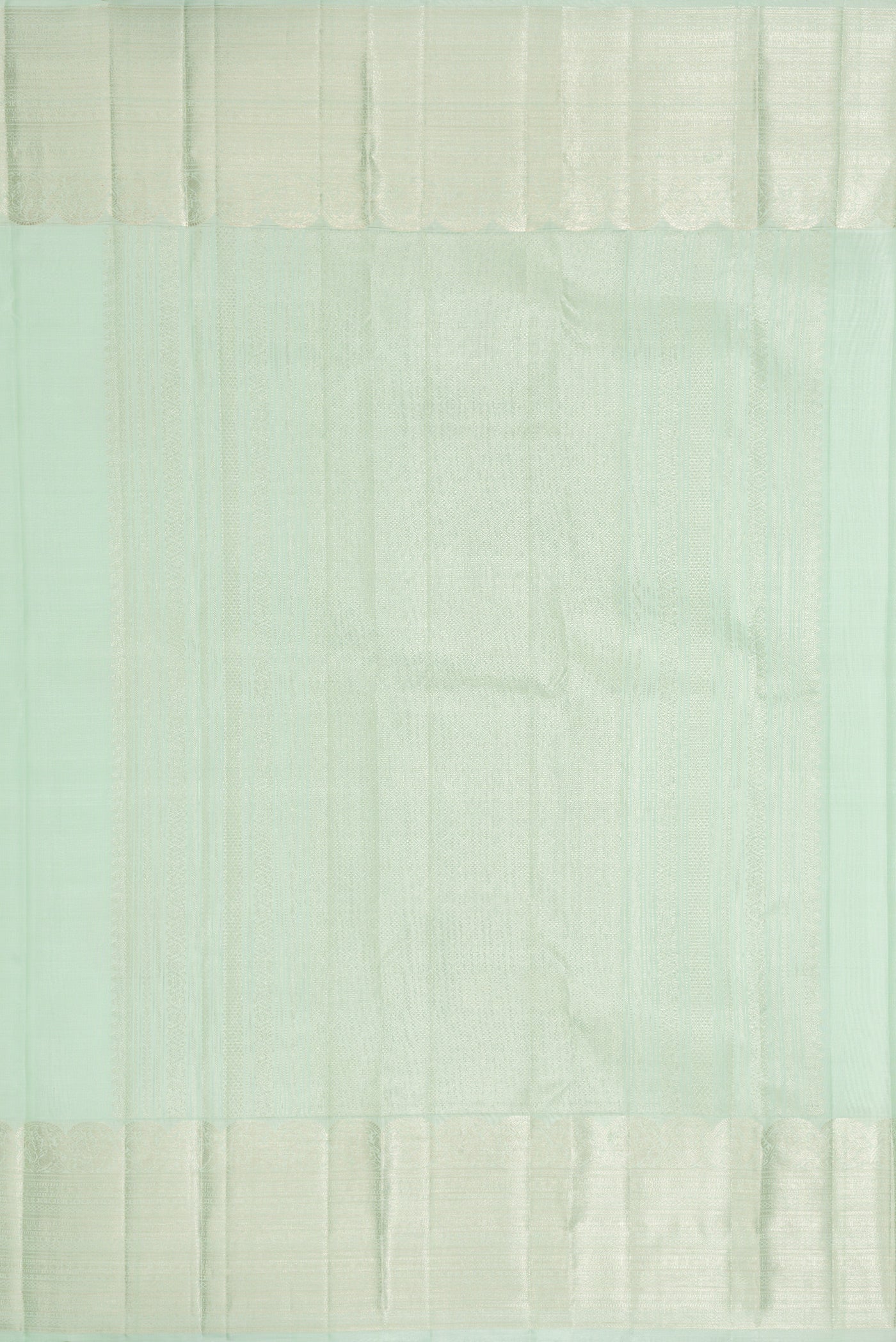 Close up image of the pallu of Pista Green Dual Tone Kanchipuram Silk Saree with Zari Butta on the body and Zari Border. 