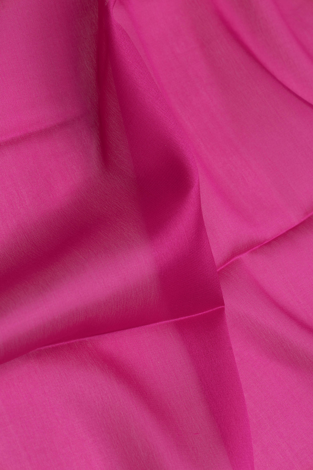 Close up of Magenta Dual Tone Mysore Silk Saree with Plain Body and Zari Border.  displaying folds