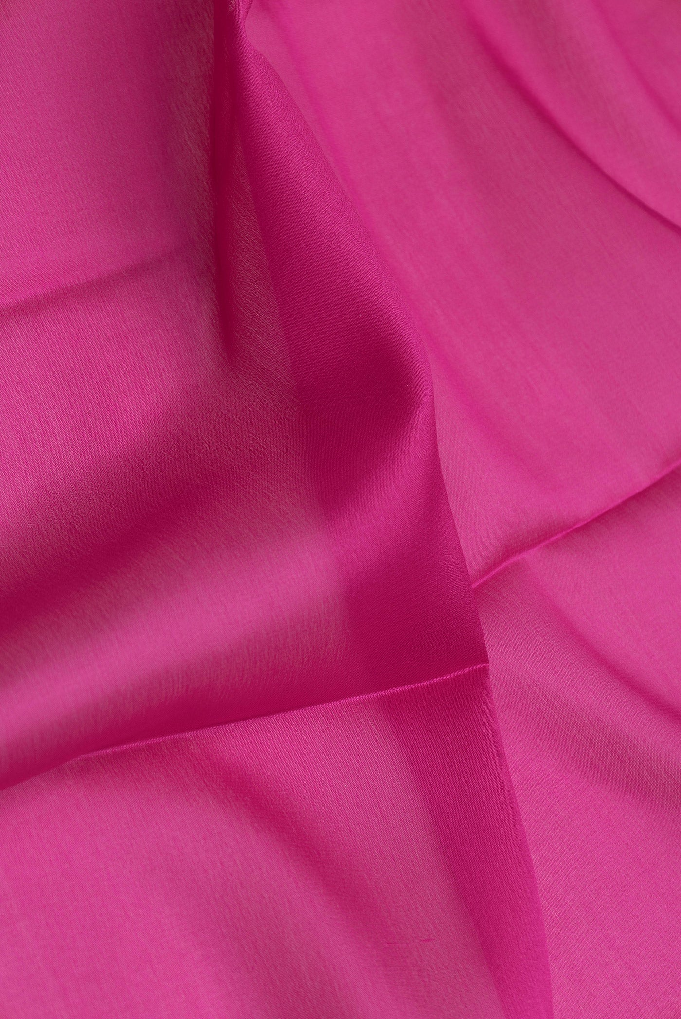 Close up of Magenta Dual Tone Mysore Silk Saree with Plain Body and Zari Border.  displaying folds