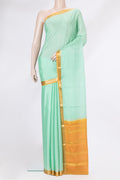 Pista Green Dual Tone Mysore Silk Saree with Plain Body and Zari Border.  displayed on a mannequin