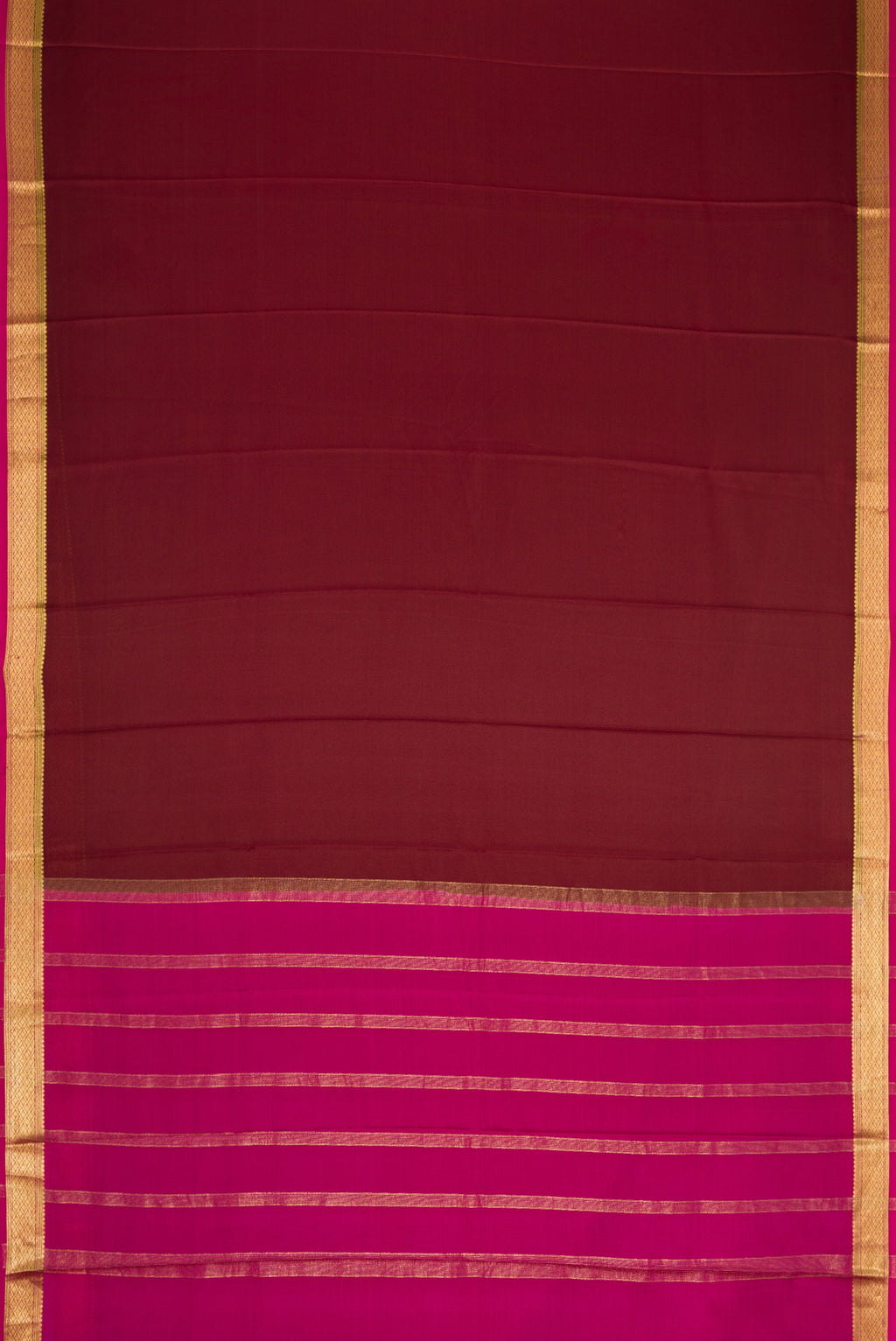 Brown Dual Tone Mysore Crepe Saree with Plain Body and Zari Border.  displayed on a mannequin