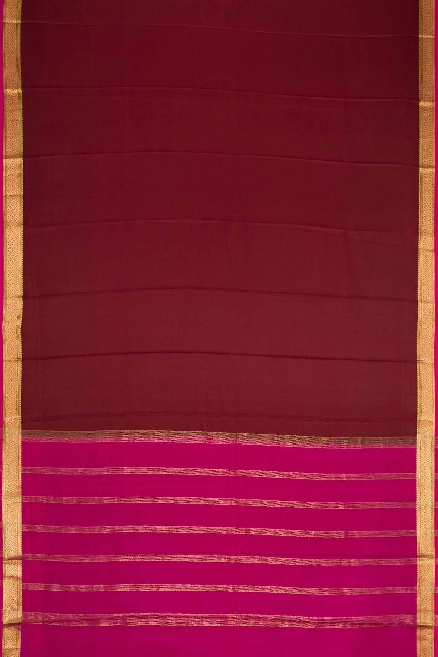 Flat view of Brown Dual Tone Mysore Crepe Saree with Plain Body and Zari Border. 