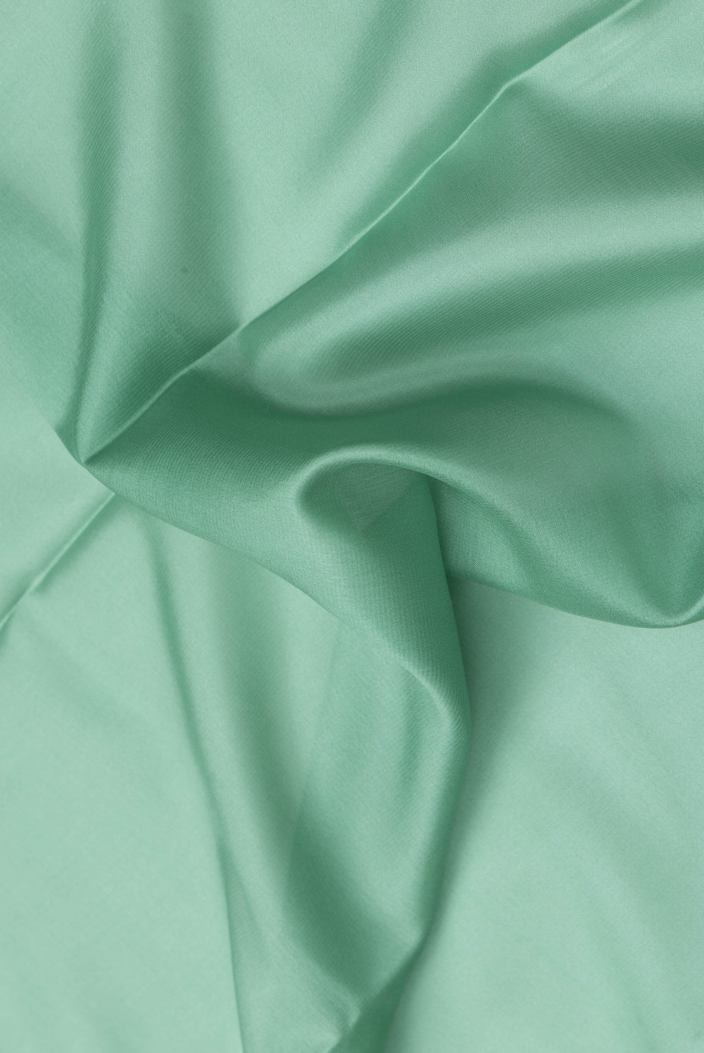 Close up of Sea Green Dual Tone Mysore Silk Saree with Plain Body and Zari Border.  displaying folds