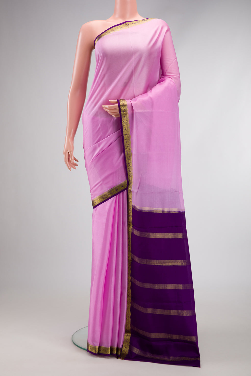 Pink Mysore Crepe Saree with Plain Body and Zari Border.  displayed on a mannequin