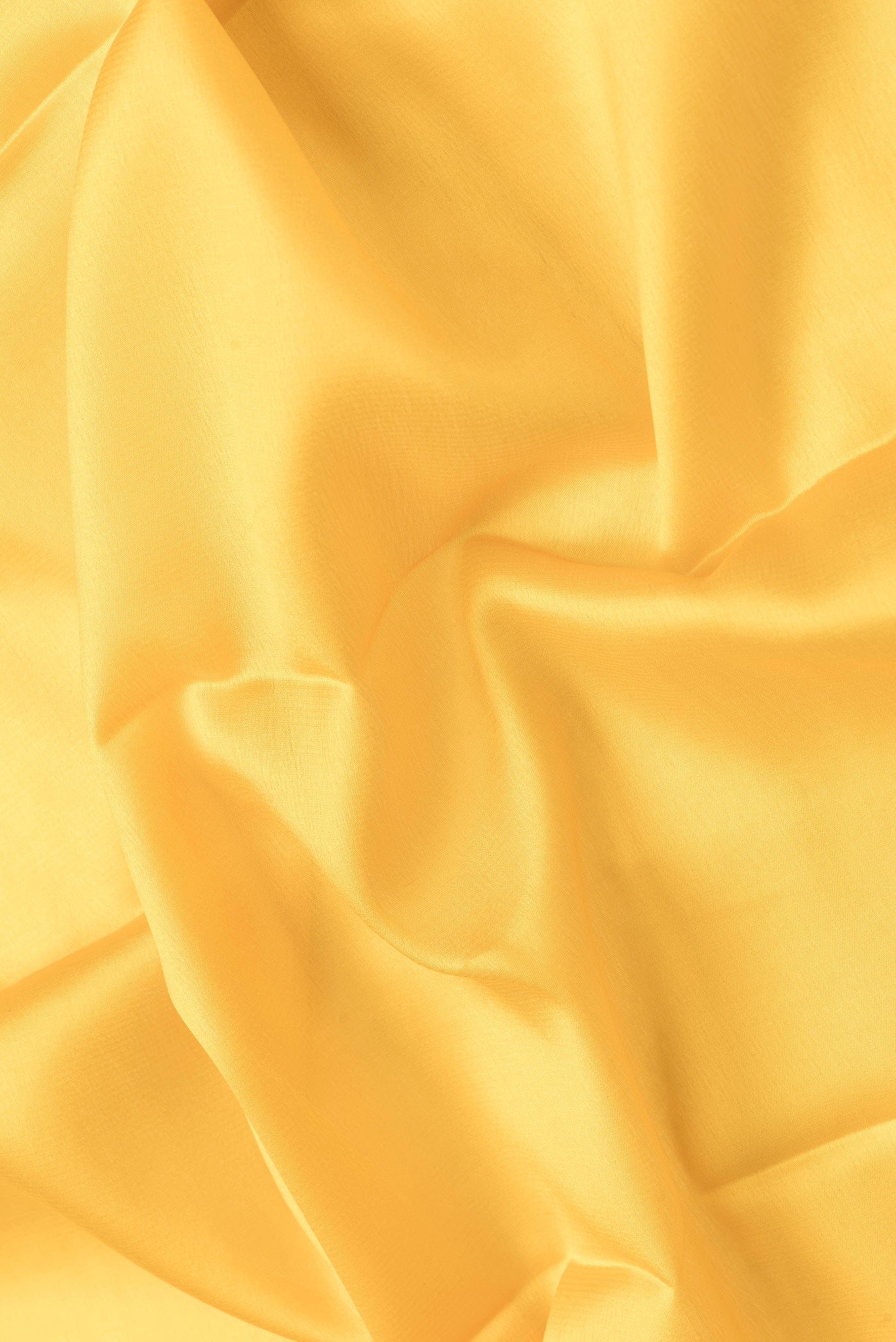 Close up of Yellow Dual Tone Mysore Silk Saree with Plain Body and Zari Border.  displaying folds