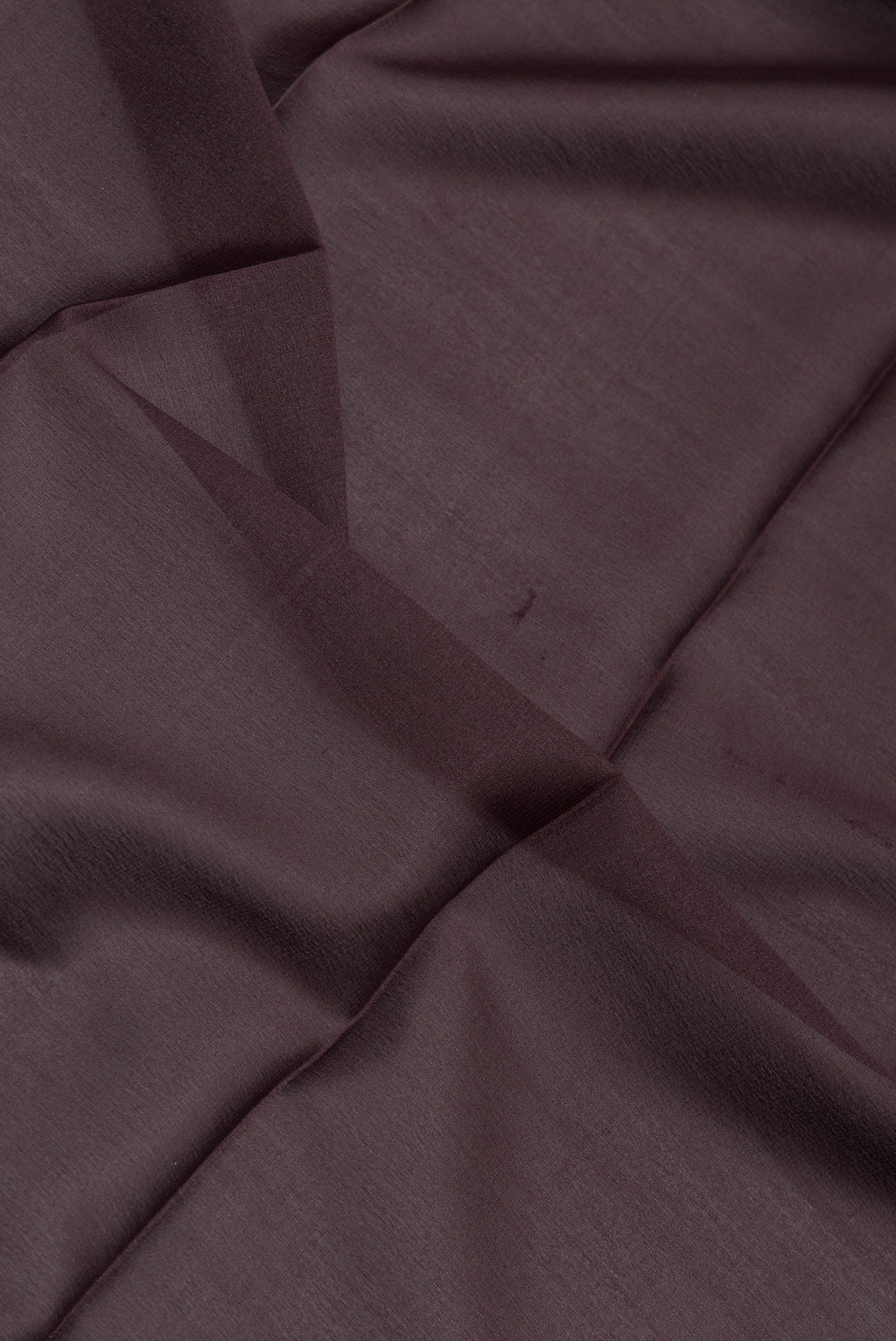 Close up of Coffee Brown Mysore Silk Saree with Plain Body and Zari Border.  displaying folds