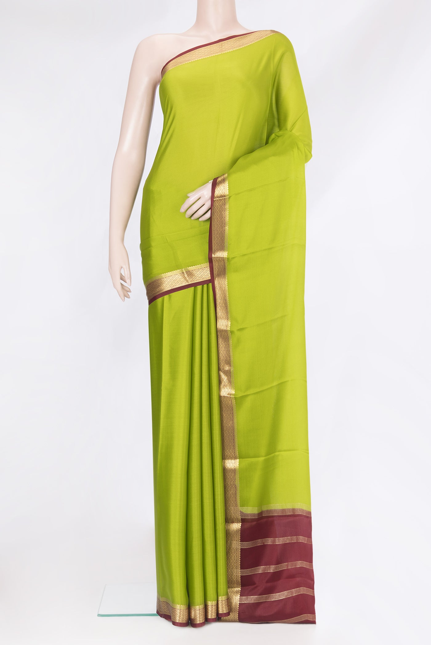 Parrot Green Mysore Silk Saree with Plain Body and Zari Border.  displayed on a mannequin