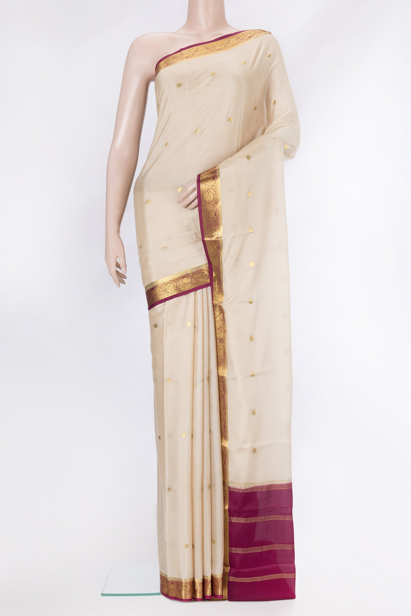 Off White Dual Tone Mysore Silk Saree with Zari Butta on the body and Zari Border.  displayed on a mannequin