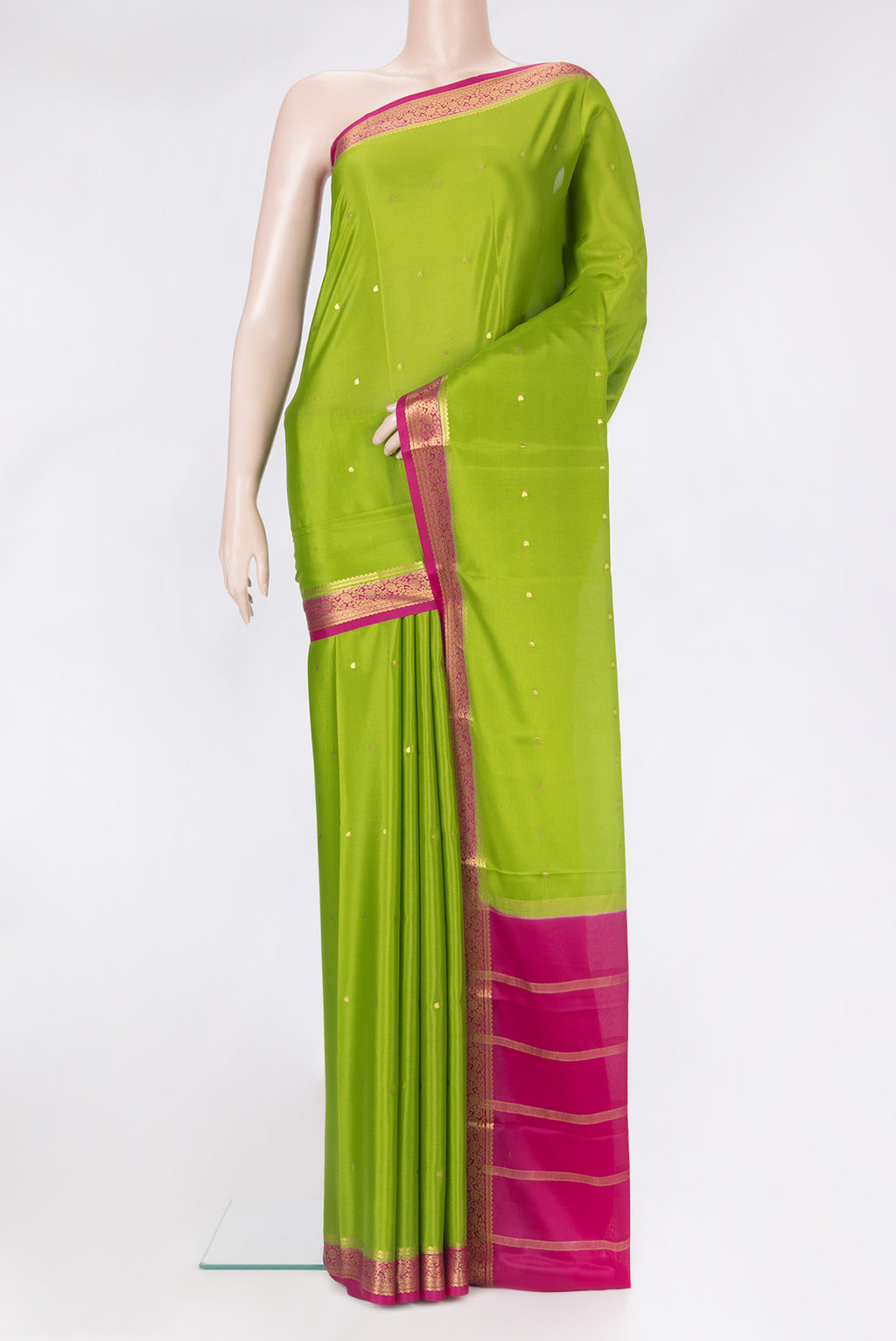 Parrot Green Mysore Silk Saree with Zari Butta on the body and Zari Border.  displayed on a mannequin