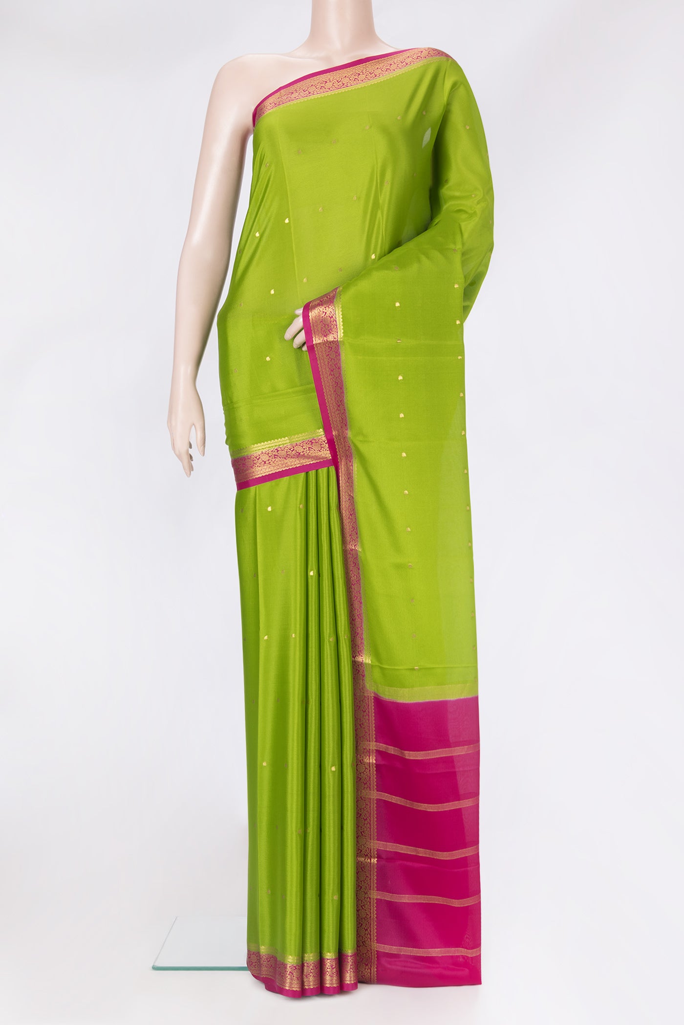 Parrot Green Mysore Silk Saree with Zari Butta on the body and Zari Border.  displayed on a mannequin