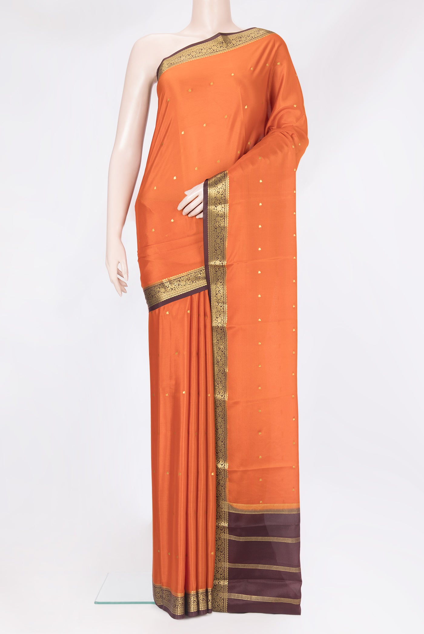 Orange Mysore Silk Saree with Zari Butta on the body and Zari Border.  displayed on a mannequin