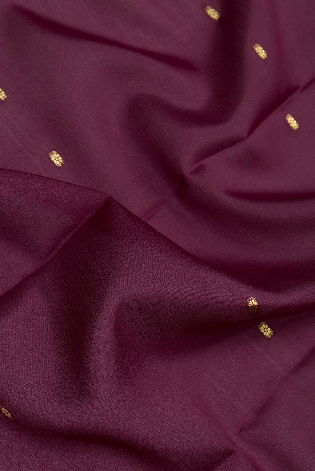 Close up of Burgundy Mysore Silk Saree with Zari Butta on the body and Zari Border.  displaying folds