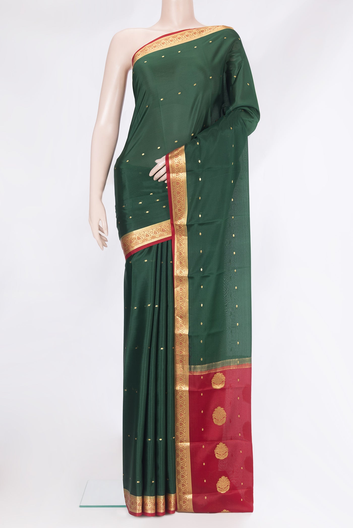 Bottle Green Mysore Silk Saree with Zari Butta on the body and Zari Border.  displayed on a mannequin
