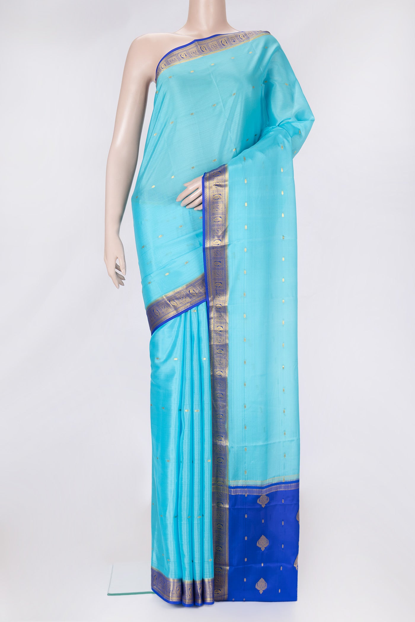 Sky Blue Dual Tone Mysore Silk Saree with Zari Butta on the body and Zari Border.  displayed on a mannequin