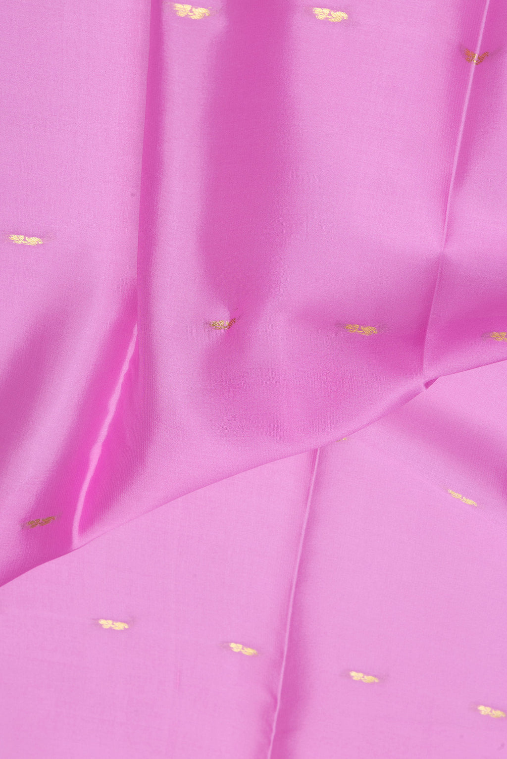 Close up of Rose pink Mysore Silk Saree with Zari Butta on the body and Zari Border.  displaying folds