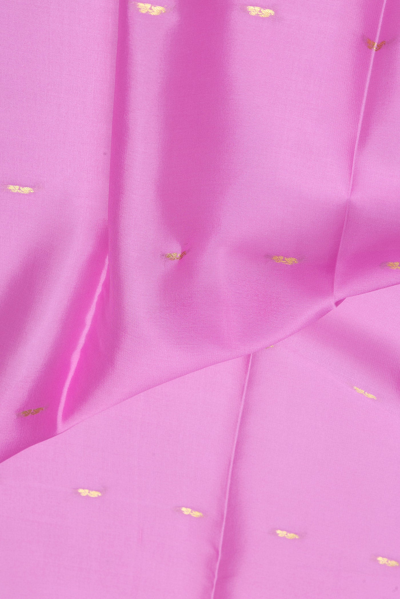 Close up of Rose pink Mysore Silk Saree with Zari Butta on the body and Zari Border.  displaying folds