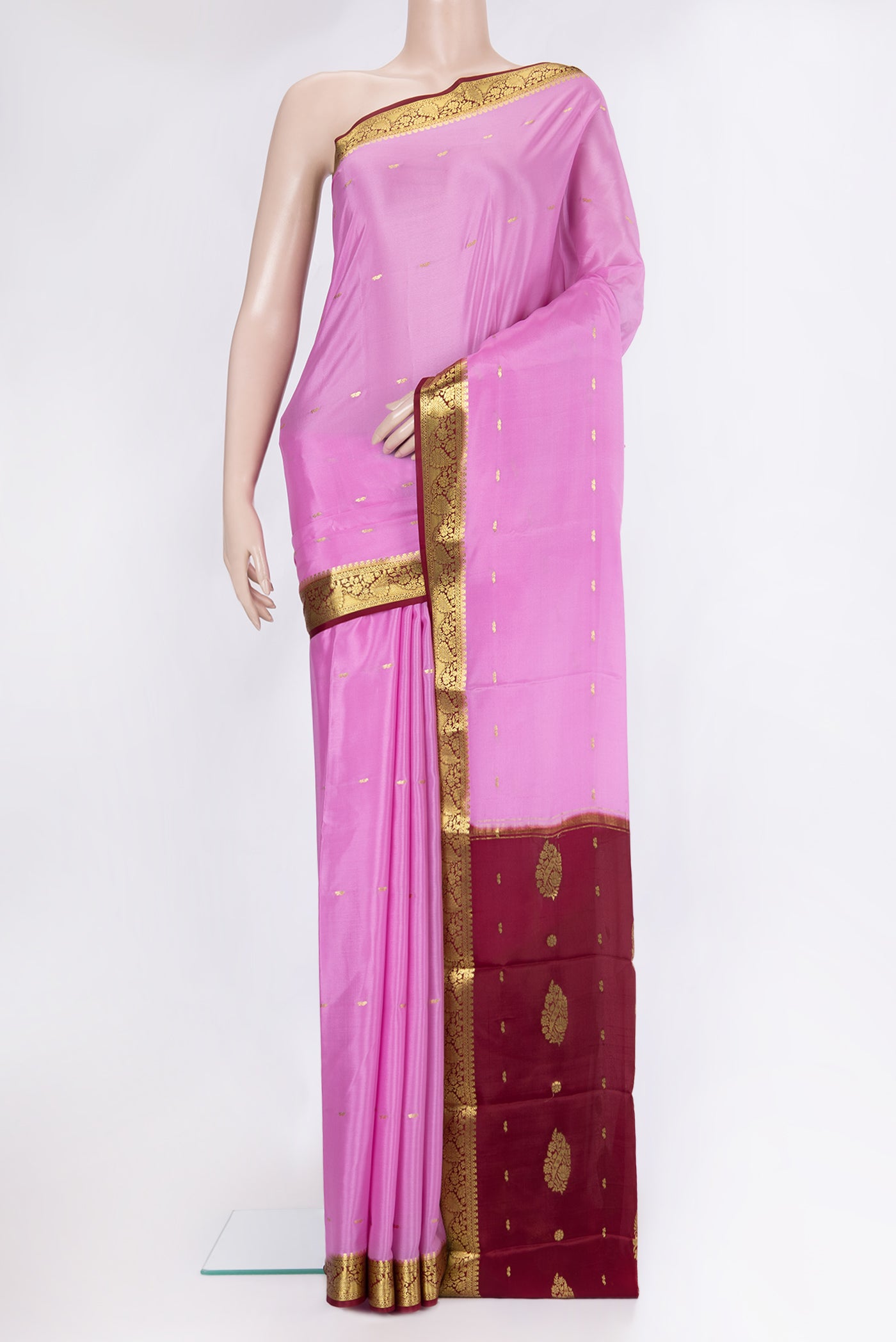 Rose pink Mysore Silk Saree with Zari Butta on the body and Zari Border.  displayed on a mannequin