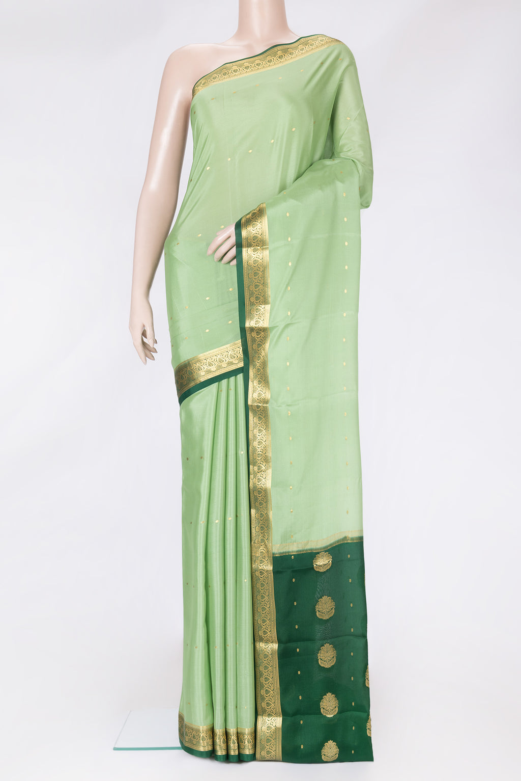 Pista Green Dual Tone Mysore Silk Saree with Zari Butta on the body and Zari Border.  displayed on a mannequin