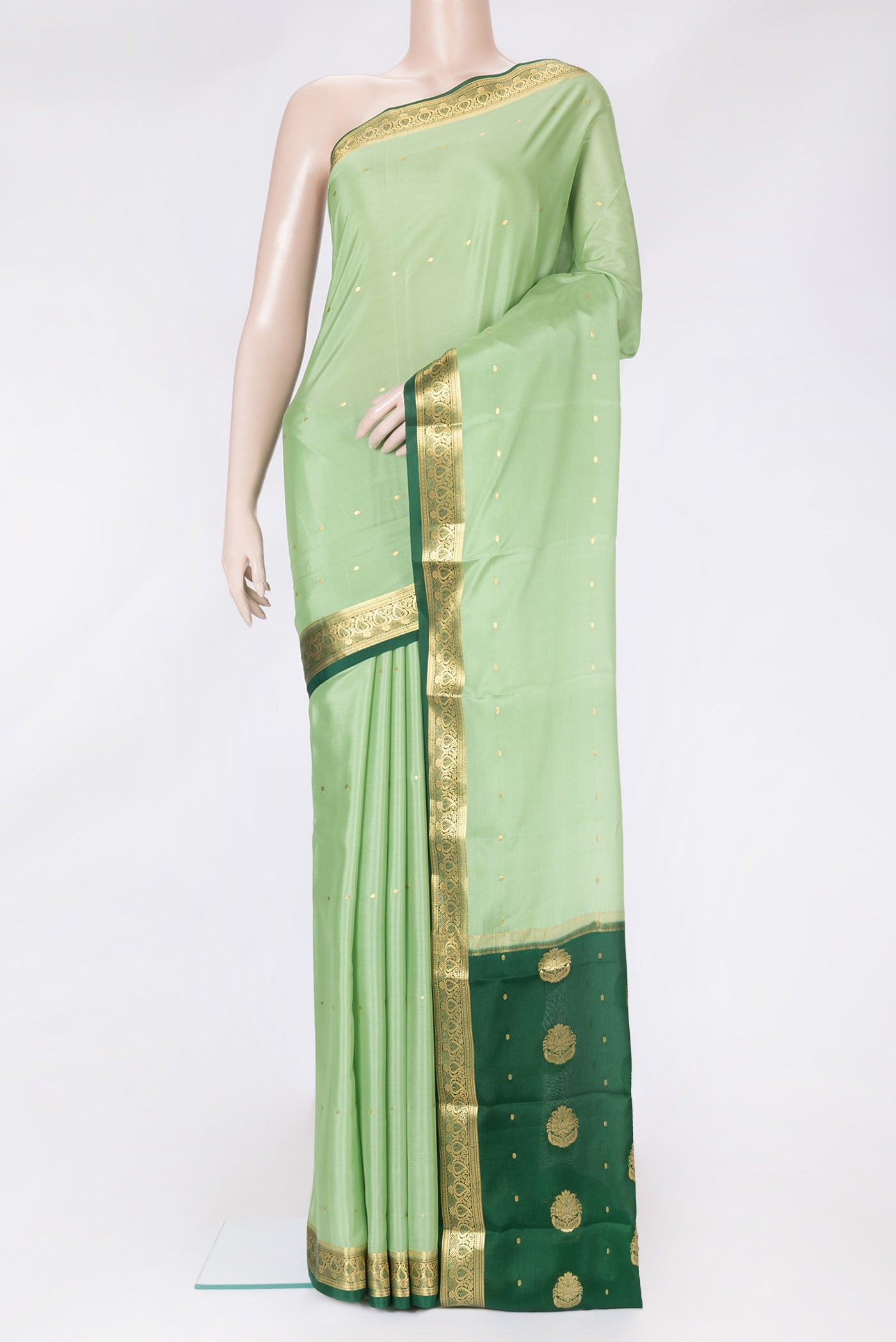 Pista Green Dual Tone Mysore Silk Saree with Zari Butta on the body and Zari Border.  displayed on a mannequin