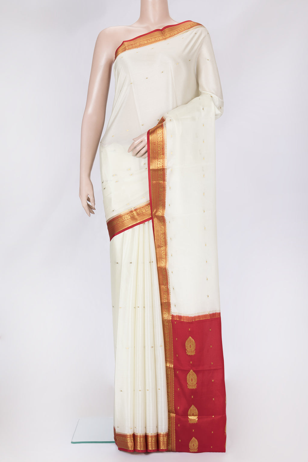Off White Dual Tone Mysore Silk Saree with Zari Butta on the body and Zari Border.  displayed on a mannequin