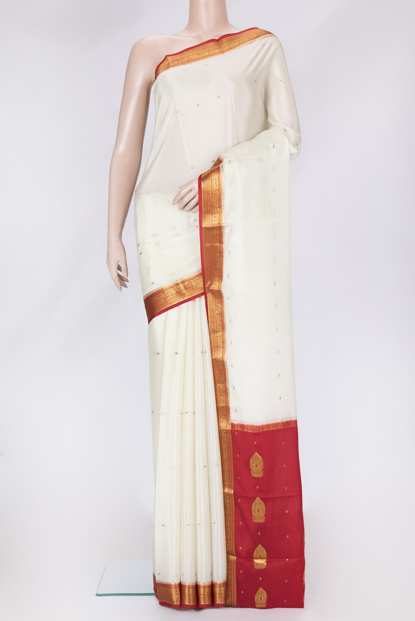 Off White Dual Tone Mysore Silk Saree with Zari Butta on the body and Zari Border.  displayed on a mannequin