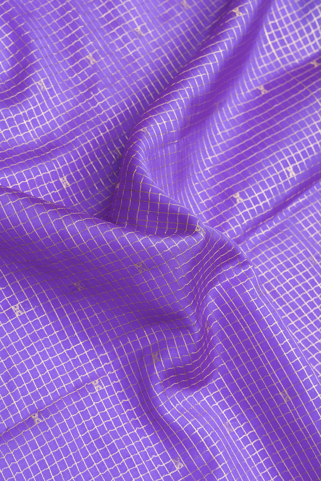 Close up of Lavender Mysore Crepe Saree with Checked design on the body and Zari Border.  displaying folds