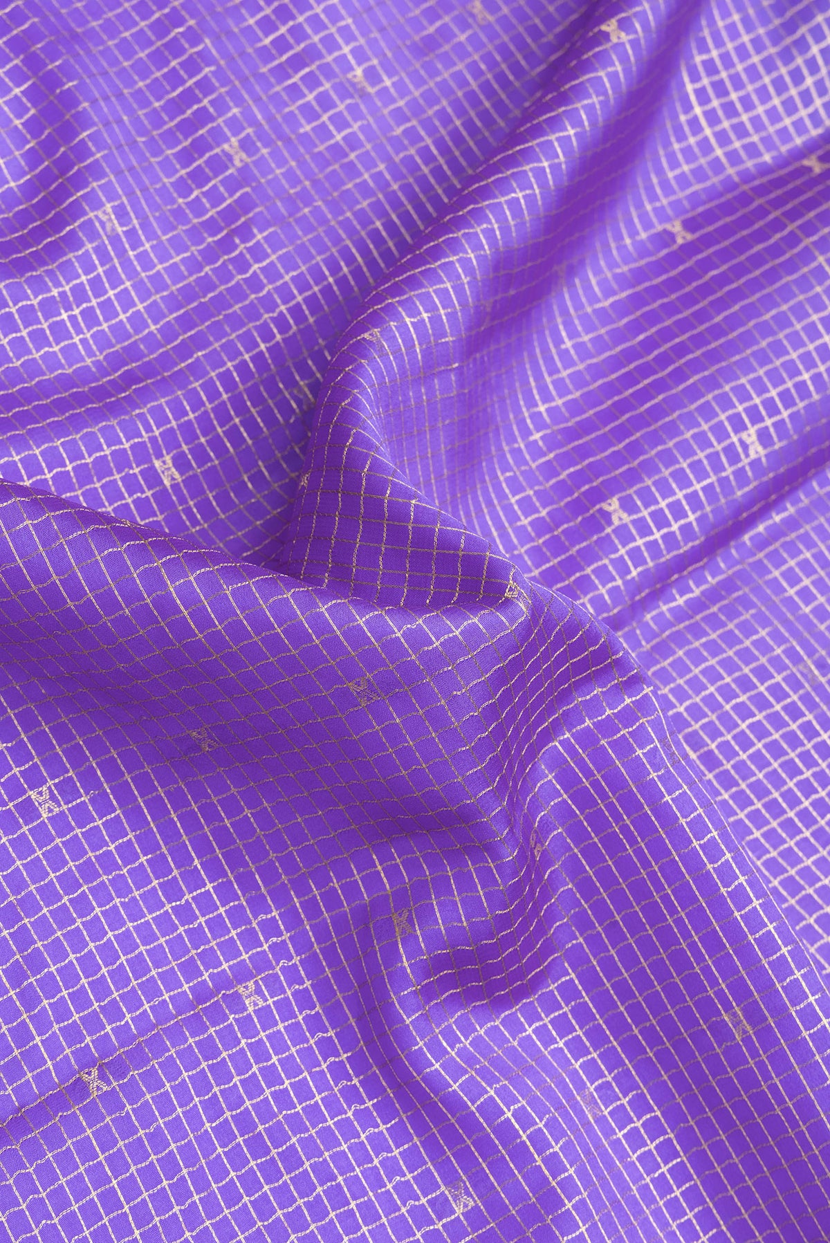 Close up of Lavender Mysore Crepe Saree with Checked design on the body and Zari Border.  displaying folds
