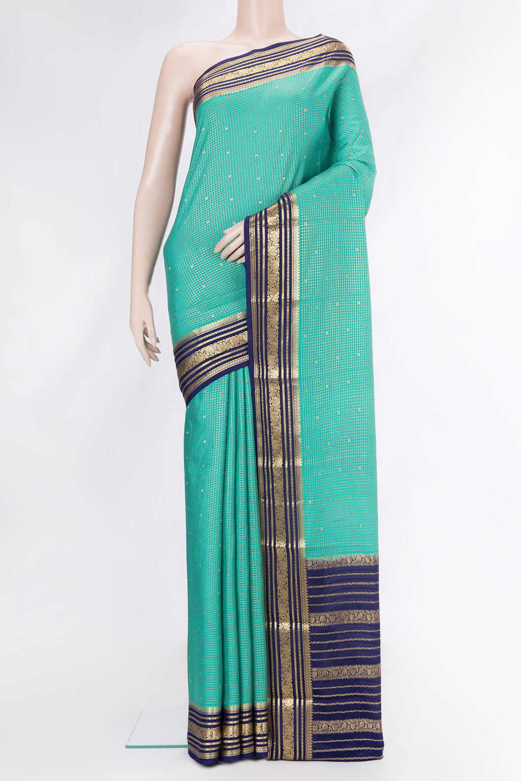 Sea Green Mysore Crepe Saree with Checked design on the body and Zari Border.  displayed on a mannequin