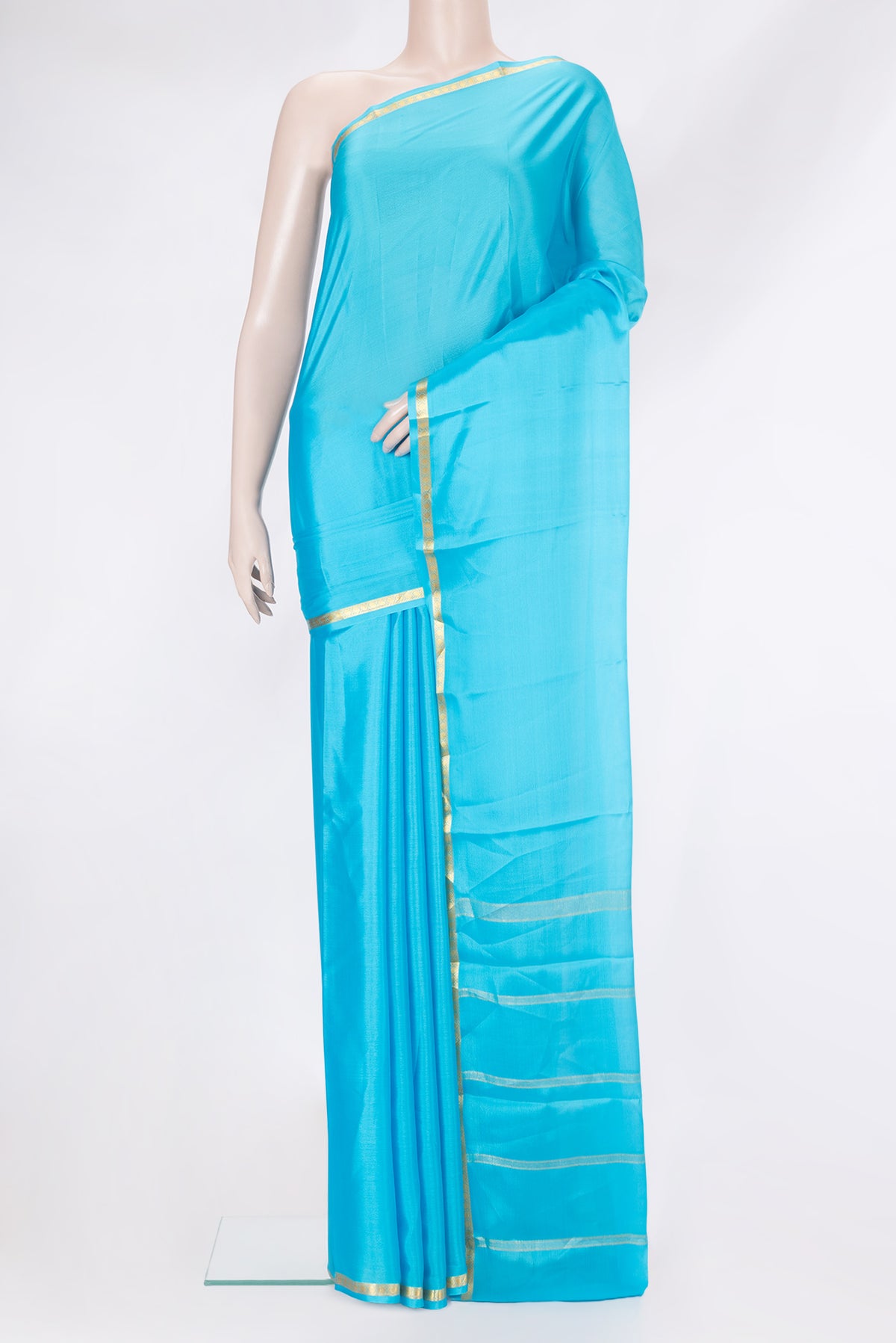 Sky Blue Mysore Silk Saree with Plain Body and Zari Border.  displayed on a mannequin