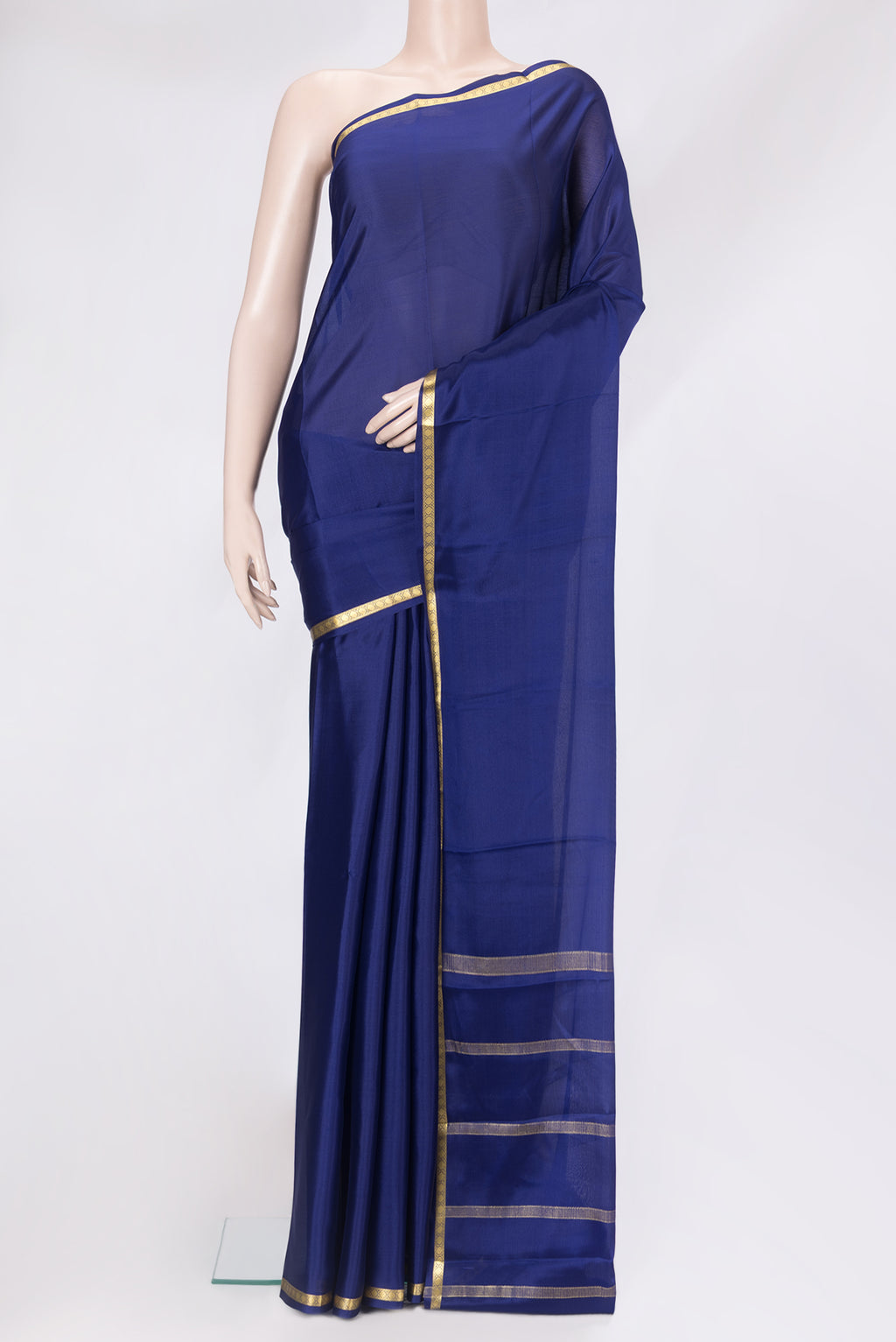 Navy Blue Mysore Crepe Saree with Plain Body and Zari Border.  displayed on a mannequin