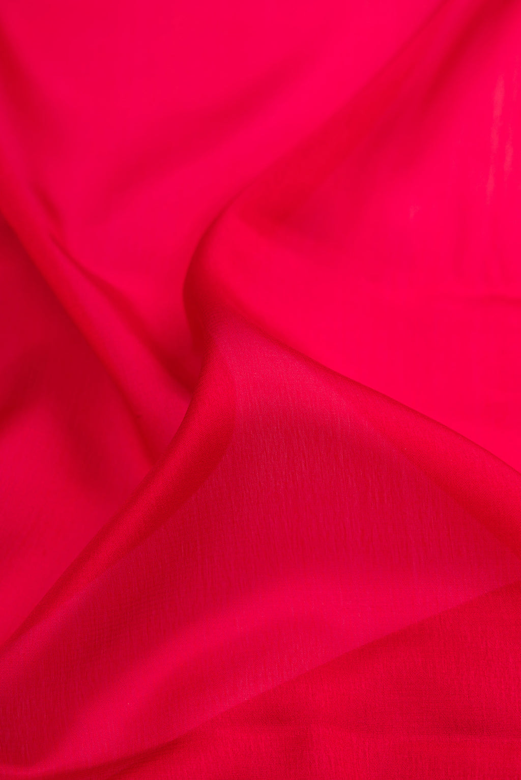 Close up of Maroon Mysore Crepe Saree with Plain Body and Zari Border.  displaying folds