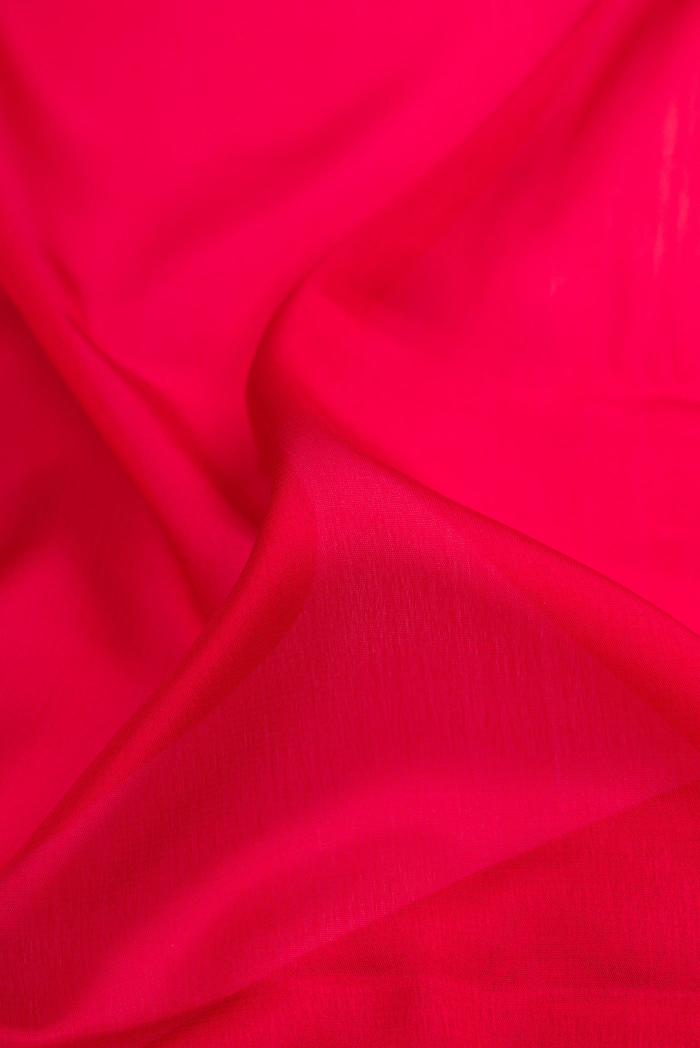 Close up of Maroon Mysore Crepe Saree with Plain Body and Zari Border.  displaying folds