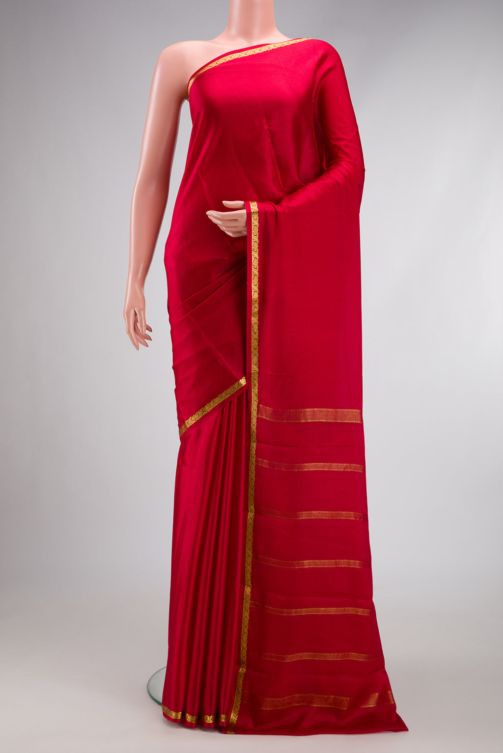 Maroon Mysore Crepe Saree with Plain Body and Zari Border.  displayed on a mannequin
