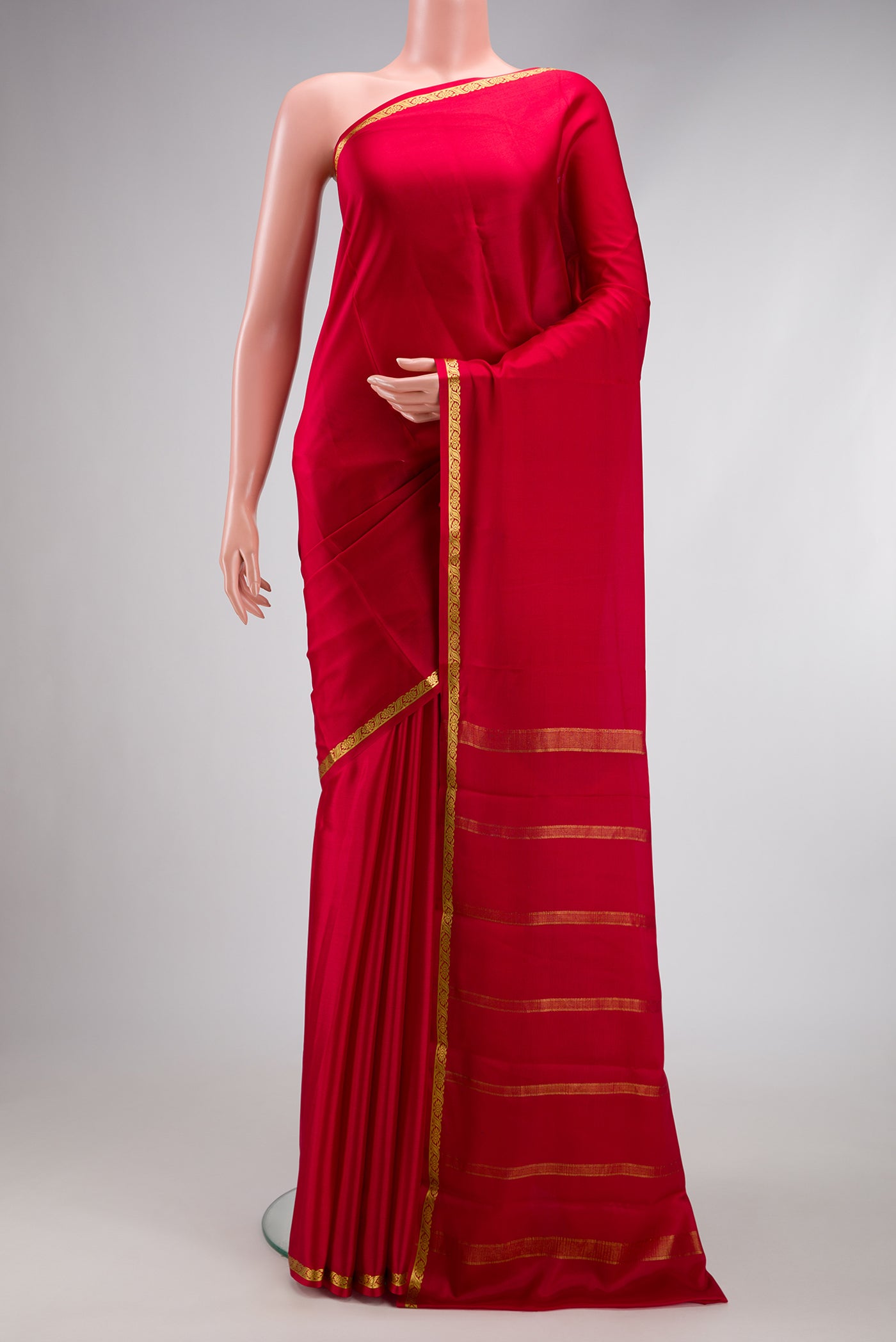 Maroon Mysore Crepe Saree with Plain Body and Zari Border.  displayed on a mannequin